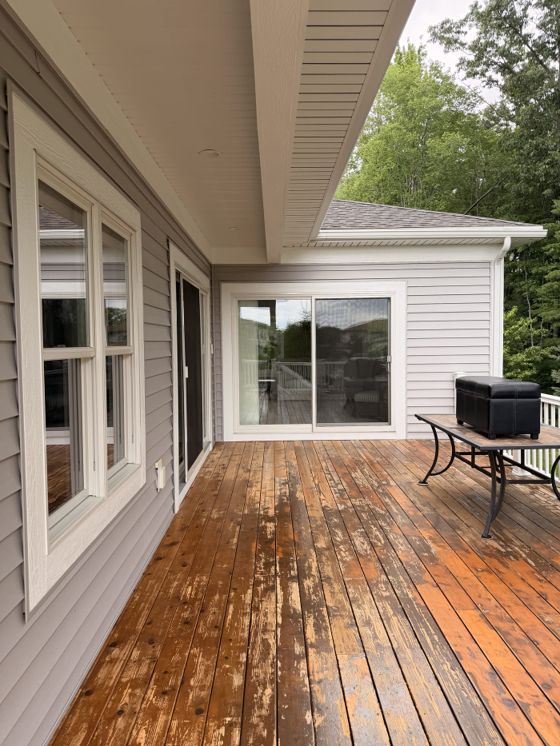 Clean exterior windows along a covered backyard deck
